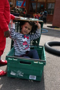 Jalilah plays with the crate 1